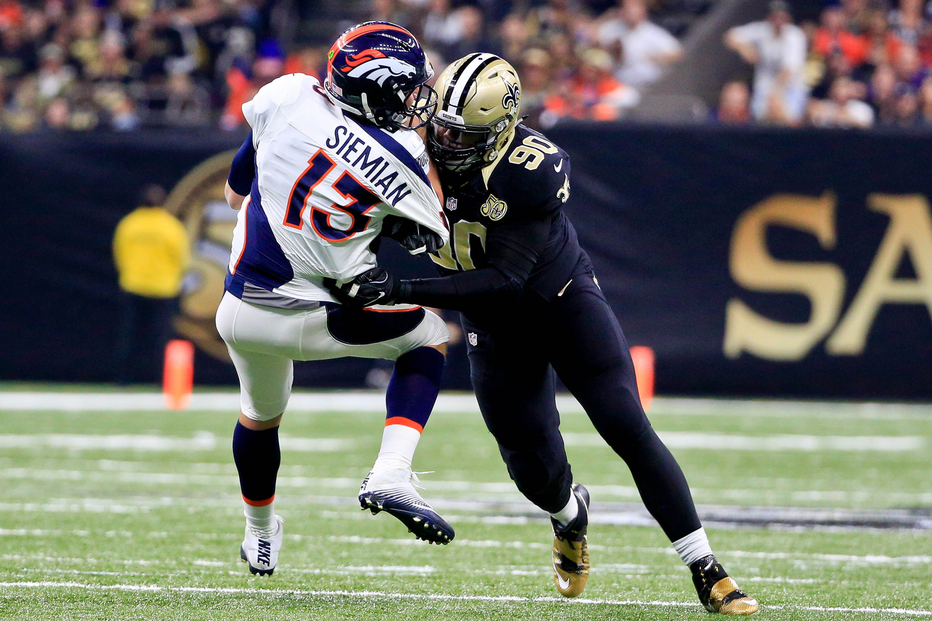 Nov 13, 2016; New Orleans, LA, USA; Denver Broncos quarterback Trevor Siemian (13) is sacked by New Orleans Saints defensive tackle Nick Fairley (90) during the first quarter of a game at the Mercedes-Benz Superdome. Mandatory Credit: Derick E. Hingle-USA TODAY Sports