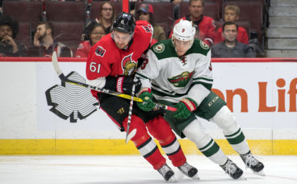 Nov 13, 2016; Ottawa, Ontario, CAN; Ottawa Senators right wing Mark Stone (61) and Minnesota Wild center Charlie Coyle (3) battle for the puck in the first period at Canadian Tire Centre. Mandatory Credit: Marc DesRosiers-USA TODAY Sports