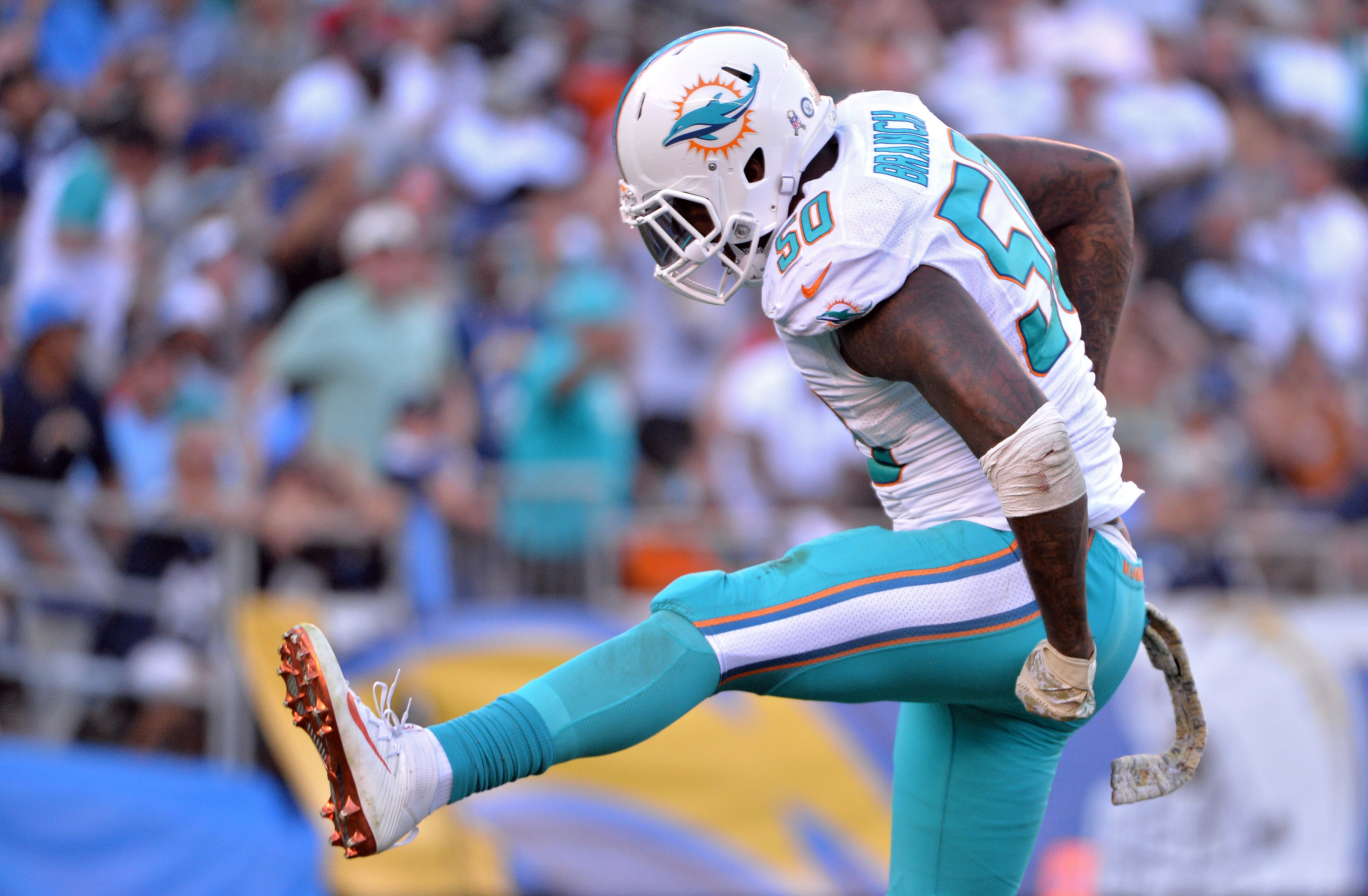 Nov 13, 2016; San Diego, CA, USA; Miami Dolphins defensive end Andre Branch (50) reacts after a sack during the second half against the San Diego Chargers at Qualcomm Stadium. Miami won 31-24. Mandatory Credit: Orlando Ramirez-USA TODAY Sports