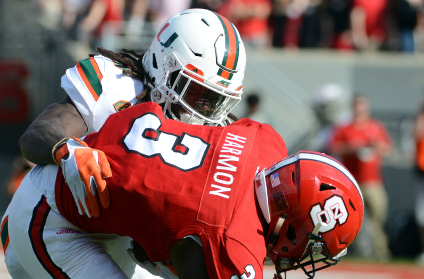 Nov 19, 2016; Raleigh, NC, USA; Miami Hurricanes defensive back Jamal Carter Sr. (6) tackles North Carolina State Wolfpack wide receiver Kelvin Harmon (3) after a catch during the first half at Carter Finley Stadium. Mandatory Credit: Rob Kinnan-USA TODAY Sports