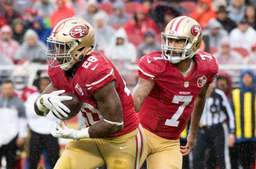 November 20, 2016; Santa Clara, CA, USA; San Francisco 49ers running back Carlos Hyde (28) receives the hand off from quarterback Colin Kaepernick (7) during the first quarter against the New England Patriots at Levi's Stadium. The Patriots defeated the 49ers 30-17. Mandatory Credit: Kyle Terada-USA TODAY Sports