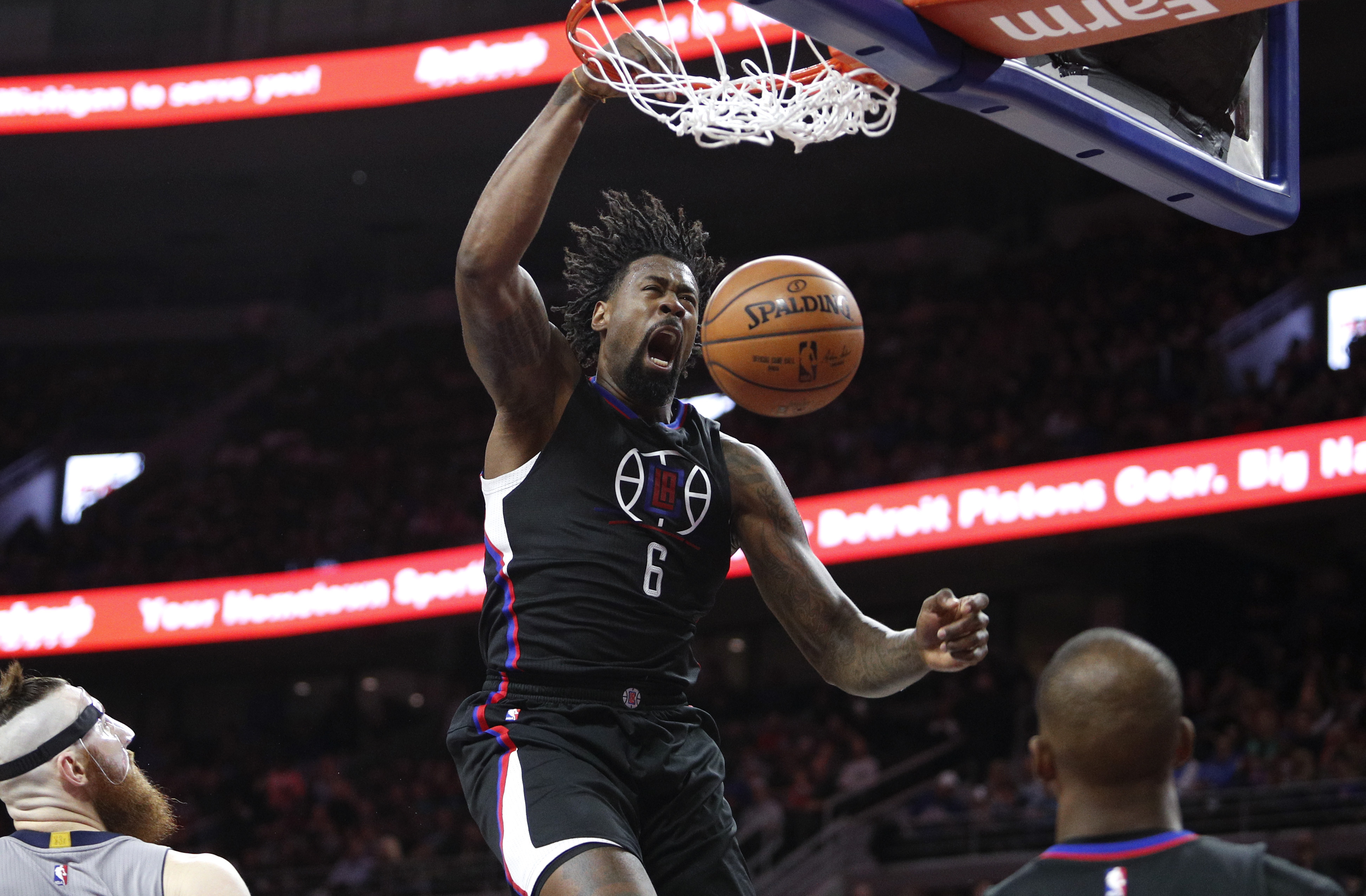 Nov 25, 2016; Auburn Hills, MI, USA; LA Clippers center DeAndre Jordan (6) makes a dunk against Detroit Pistons center Aron Baynes (12) during the second quarter at The Palace of Auburn Hills. Mandatory Credit: Raj Mehta-USA TODAY Sports