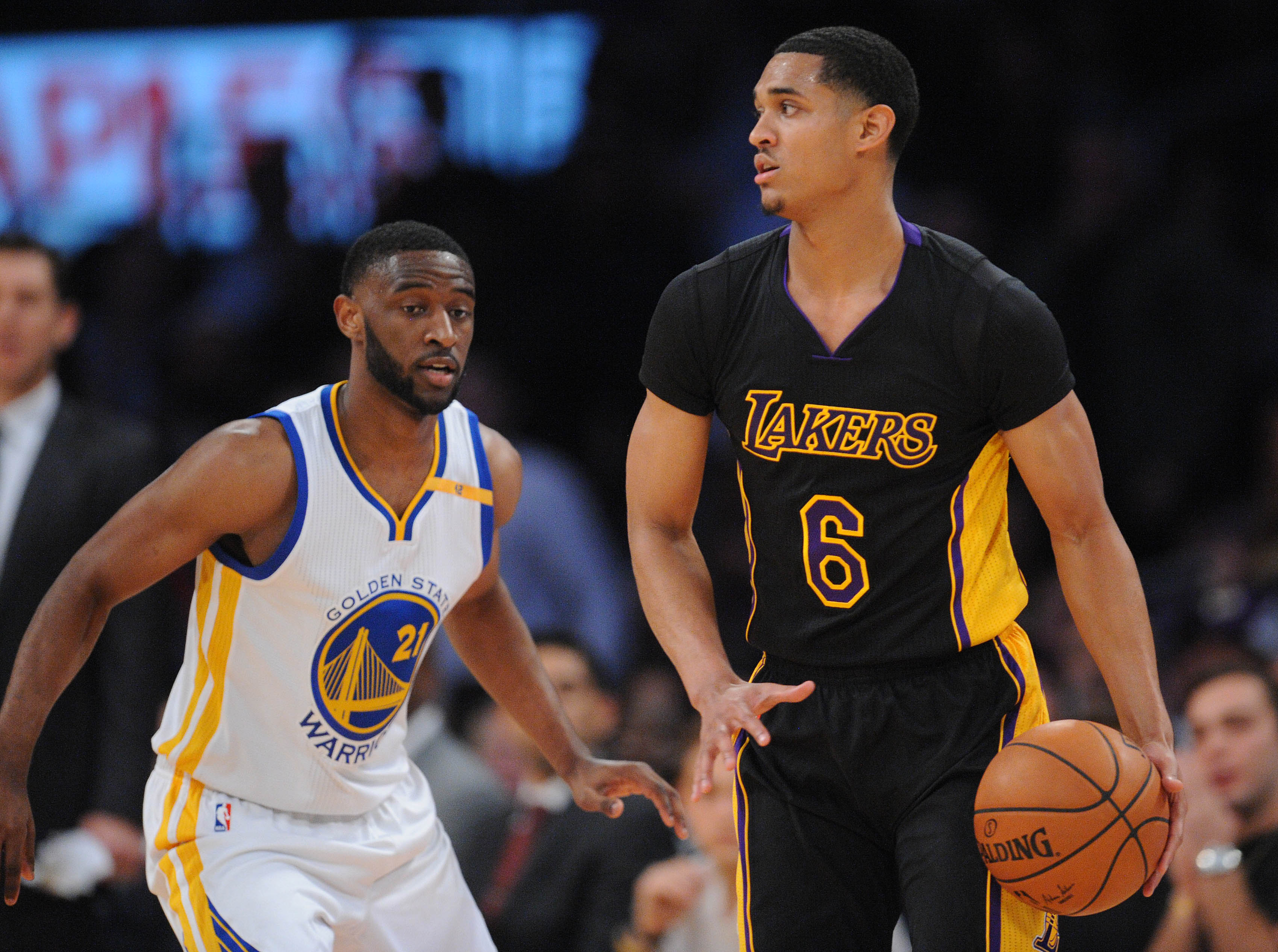 November 25, 2016; Los Angeles, CA, USA; Los Angeles Lakers guard Jordan Clarkson (6) moves the ball against Golden State Warriors guard Ian Clark (21) during the first half at Staples Center. Mandatory Credit: Gary A. Vasquez-USA TODAY Sports