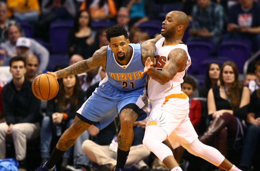 Nov 27, 2016; Phoenix, AZ, USA; Denver Nuggets forward Wilson Chandler (21) controls the ball against Phoenix Suns forward P.J. Tucker at Talking Stick Resort Arena. The Nuggets defeated the Suns 118-114. Mandatory Credit: Mark J. Rebilas-USA TODAY Sports