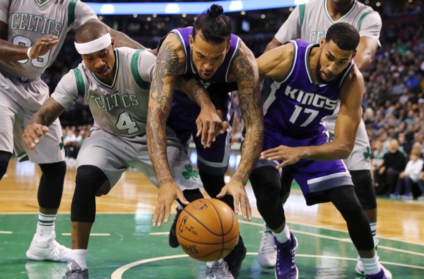 Dec 2, 2016; Boston, MA, USA; Boston Celtics guard Isaiah Thomas (4) and Sacramento Kings forward Matt Barnes (22) and Kings guard Garrett Temple (17) battle for a loose ball during the first half at TD Garden. Mandatory Credit: Winslow Townson-USA TODAY Sports