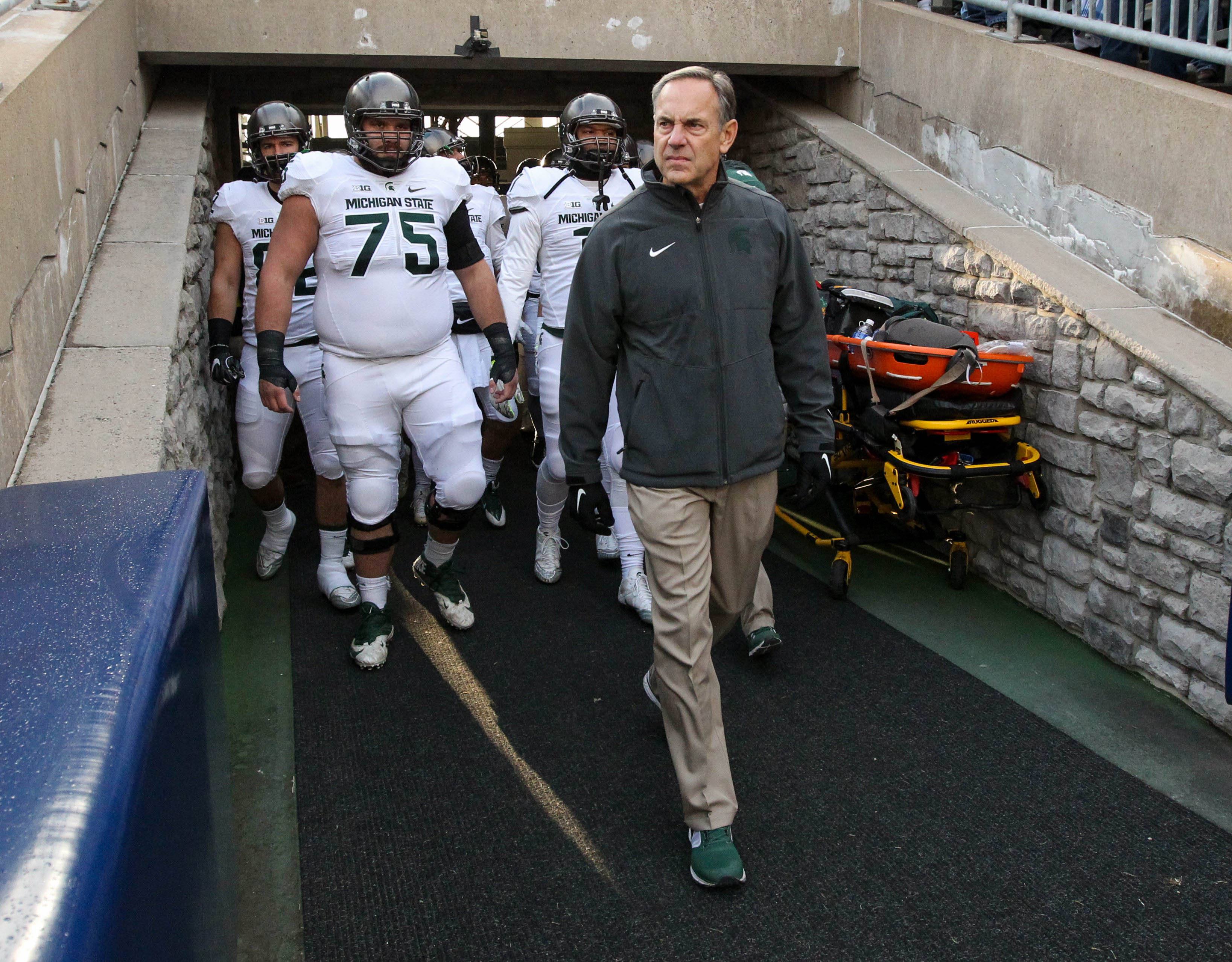 Nov 26, 2016; University Park, PA, USA; Michigan State Spartans head coach Mark Dantonio leads his team out of the tunnel prior to the game against the Penn State Nittany Lions at Beaver Stadium. Penn State defeated Michigan State 45-12. Mandatory Credit: Matthew O'Haren-USA TODAY Sports