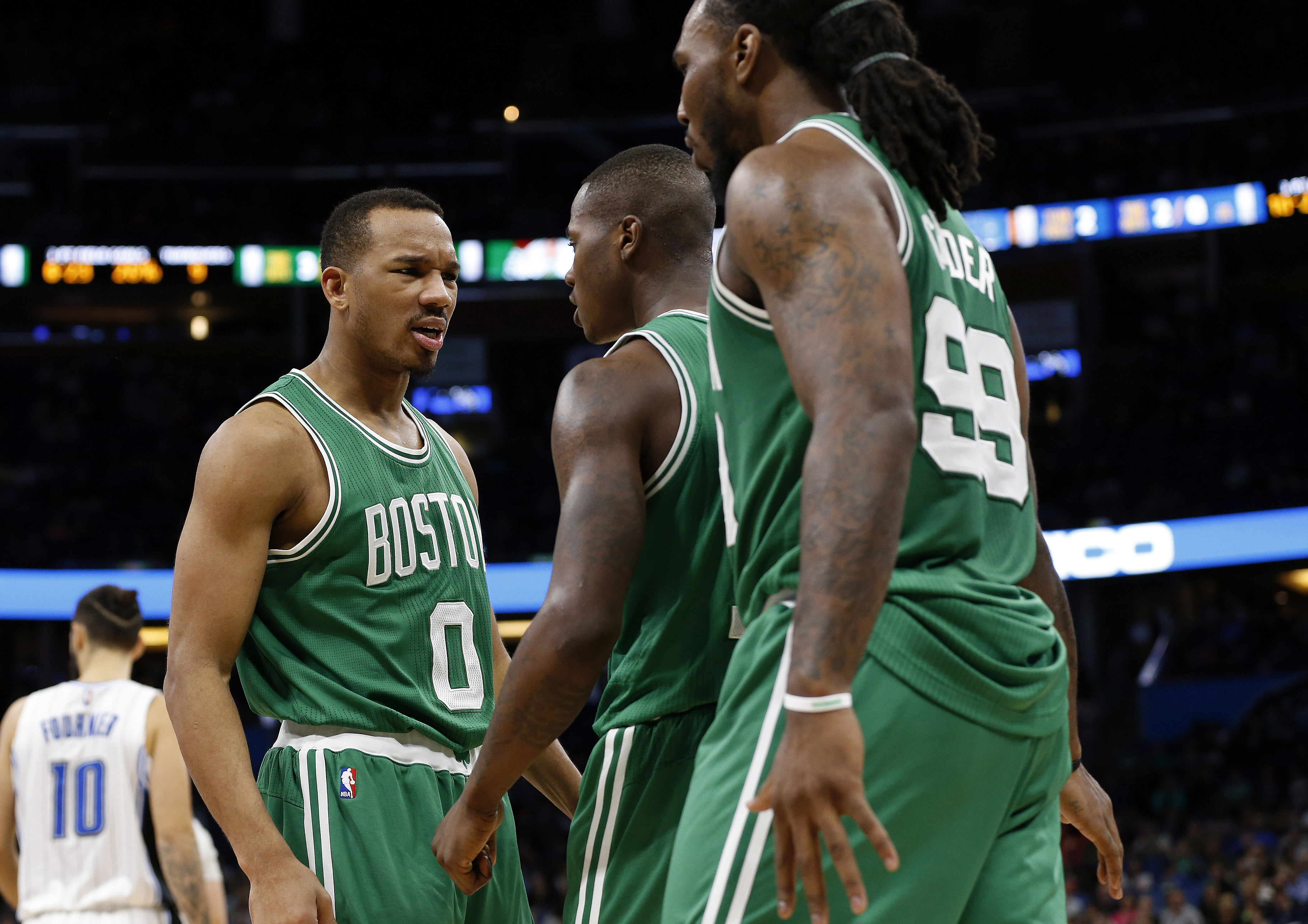 Dec 7, 2016; Orlando, FL, USA; Boston Celtics guard Avery Bradley (0) reacts with guard Terry Rozier (12) and forward Jae Crowder (99) against the Orlando Magic during the second half at Amway Center. Boston Celtics defeated the Orlando Magic 117-87. Mandatory Credit: Kim Klement-USA TODAY Sports