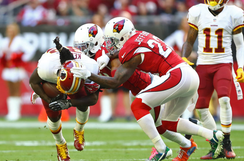 Dec 4, 2016; Glendale, AZ, USA; Washington Redskins running back Robert Kelley (32) is tackled by Arizona Cardinals safety Tony Jefferson (22) at University of Phoenix Stadium. The Cardinals defeated the Redskins 31-23. Mandatory Credit: Mark J. Rebilas-USA TODAY Sports