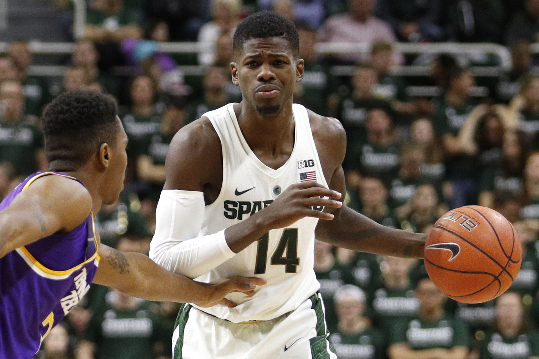 Dec 10, 2016; East Lansing, MI, USA; Michigan State Spartans guard Eron Harris (14) gets defended by Tennessee Tech Golden Eagles guard Hakeem Rogers (2) during the second half at Jack Breslin Student Events Center. Spartans win 71-63. Mandatory Credit: Raj Mehta-USA TODAY Sports