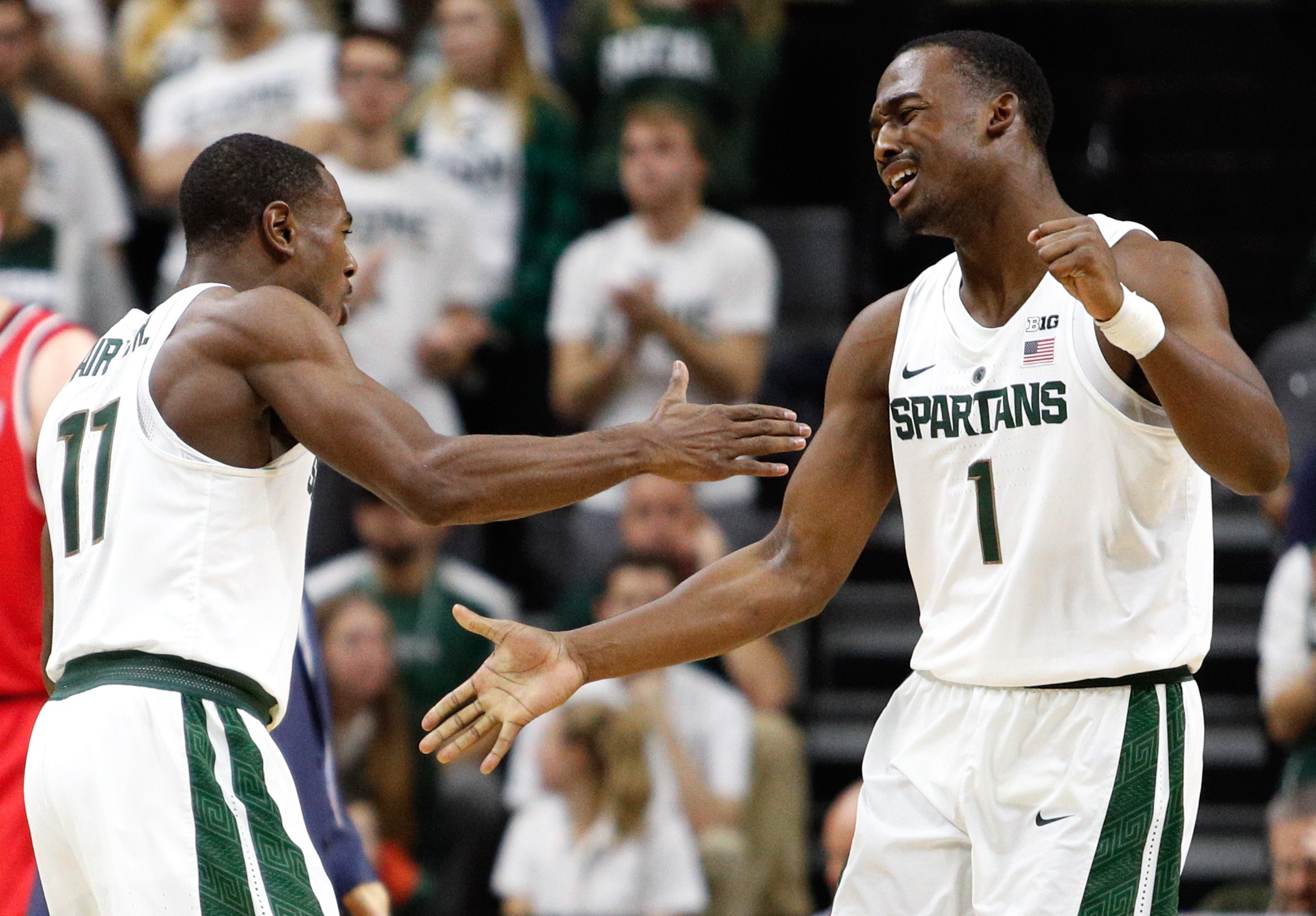 Dec 6, 2016; East Lansing, MI, USA; Michigan State Spartans guard Joshua Langford (1) celebrates with guard Lourawls Nairn Jr. (11) during the second half against the Youngstown State Penguins at Jack Breslin Student Events Center. Spartans win 77-57. Mandatory Credit: Raj Mehta-USA TODAY Sports