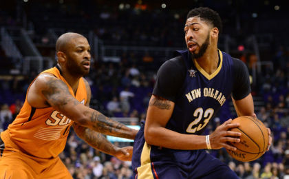 Dec 11, 2016; Phoenix, AZ, USA; New Orleans Pelicans forward Anthony Davis (23) handles the ball against Phoenix Suns forward P.J. Tucker (17) in the first half at Talking Stick Resort Arena. Mandatory Credit: Jennifer Stewart-USA TODAY Sports