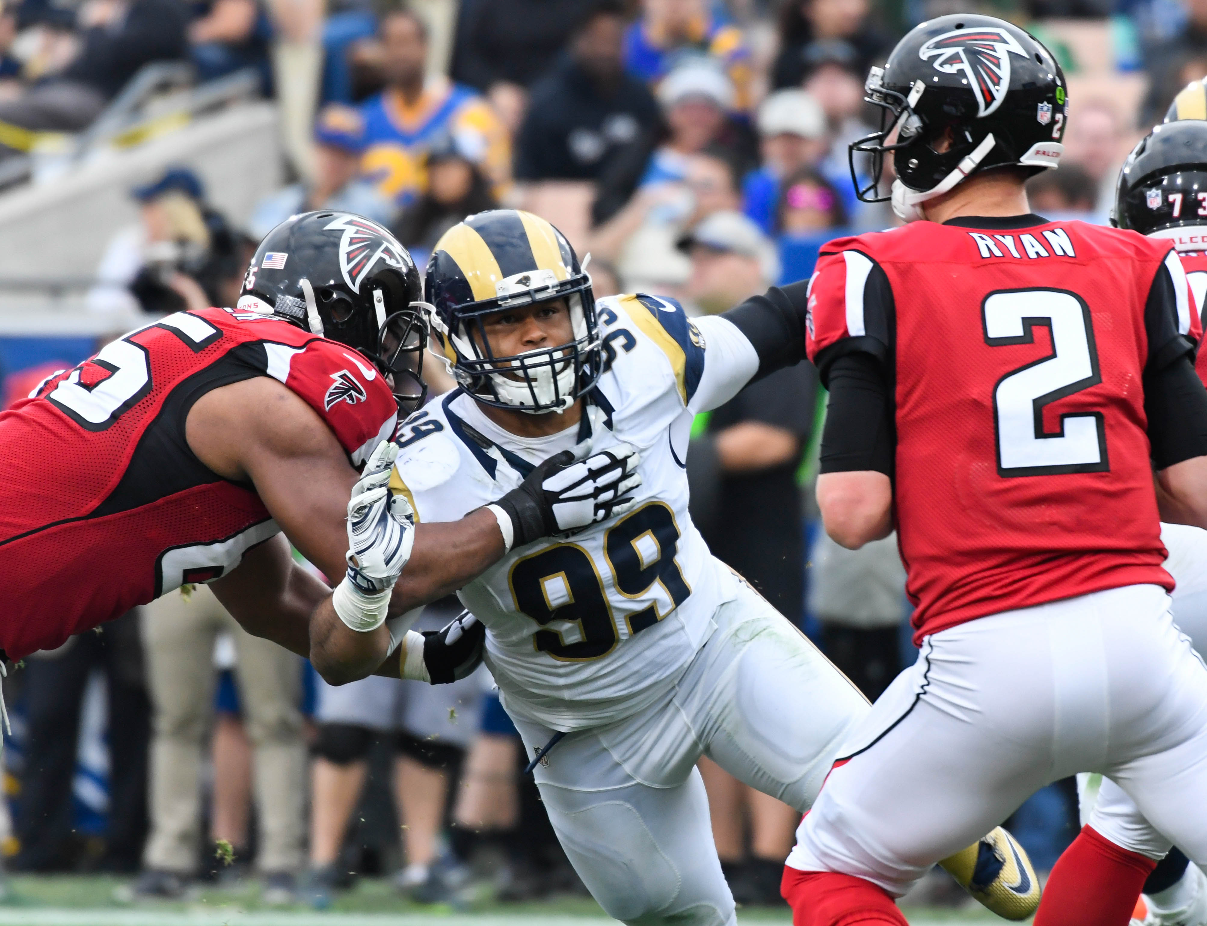 Dec 11, 2016; Los Angeles, CA, USA; Los Angeles Rams defensive tackle Aaron Donald (99) pressures Atlanta Falcons quarterback Matt Ryan (2) at the Los Angeles Memorial Coliseum. Mandatory Credit: Robert Hanashiro-USA TODAY Sports