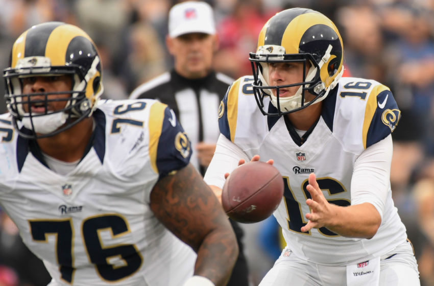 Dec 11, 2016; Los Angeles, CA, USA; Los Angeles Rams quarterback Jared Goff (16) takes the snap during the first half against the Atlanta Falcons at Los Angeles Memorial Coliseum. Los Angeles Rams guard Rodger Saffold (76) is in the foreground. Mandatory Credit: Robert Hanashiro-USA TODAY Sports