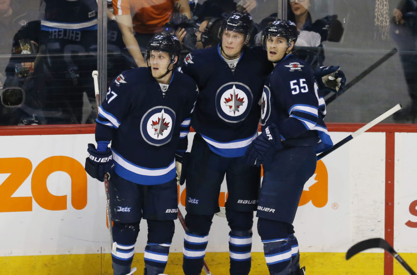 Dec 18, 2016; Winnipeg, Manitoba, CAN; Winnipeg Jets right wing Patrik Laine (29) celebrates with teammates after scoring a goal during the second period against the Colorado Avalanche at MTS Centre. Mandatory Credit: Bruce Fedyck-USA TODAY Sports