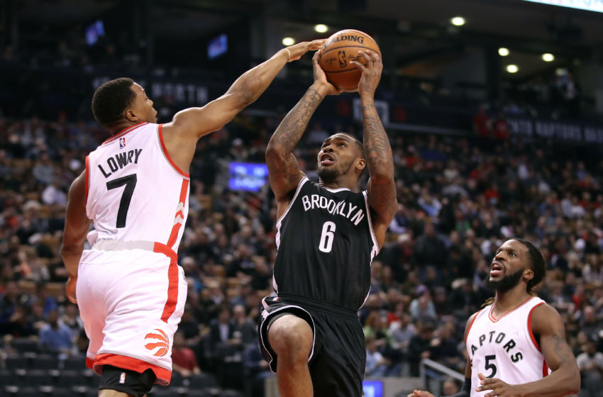 Dec 20, 2016; Toronto, Ontario, CAN; Brooklyn Nets guard Sean Kilpatrick (6) is fouled by Toronto Raptors point guard Kyle Lowry (7) at Air Canada Centre. The Raptors beat the Nets 116-104. Mandatory Credit: Tom Szczerbowski-USA TODAY Sports