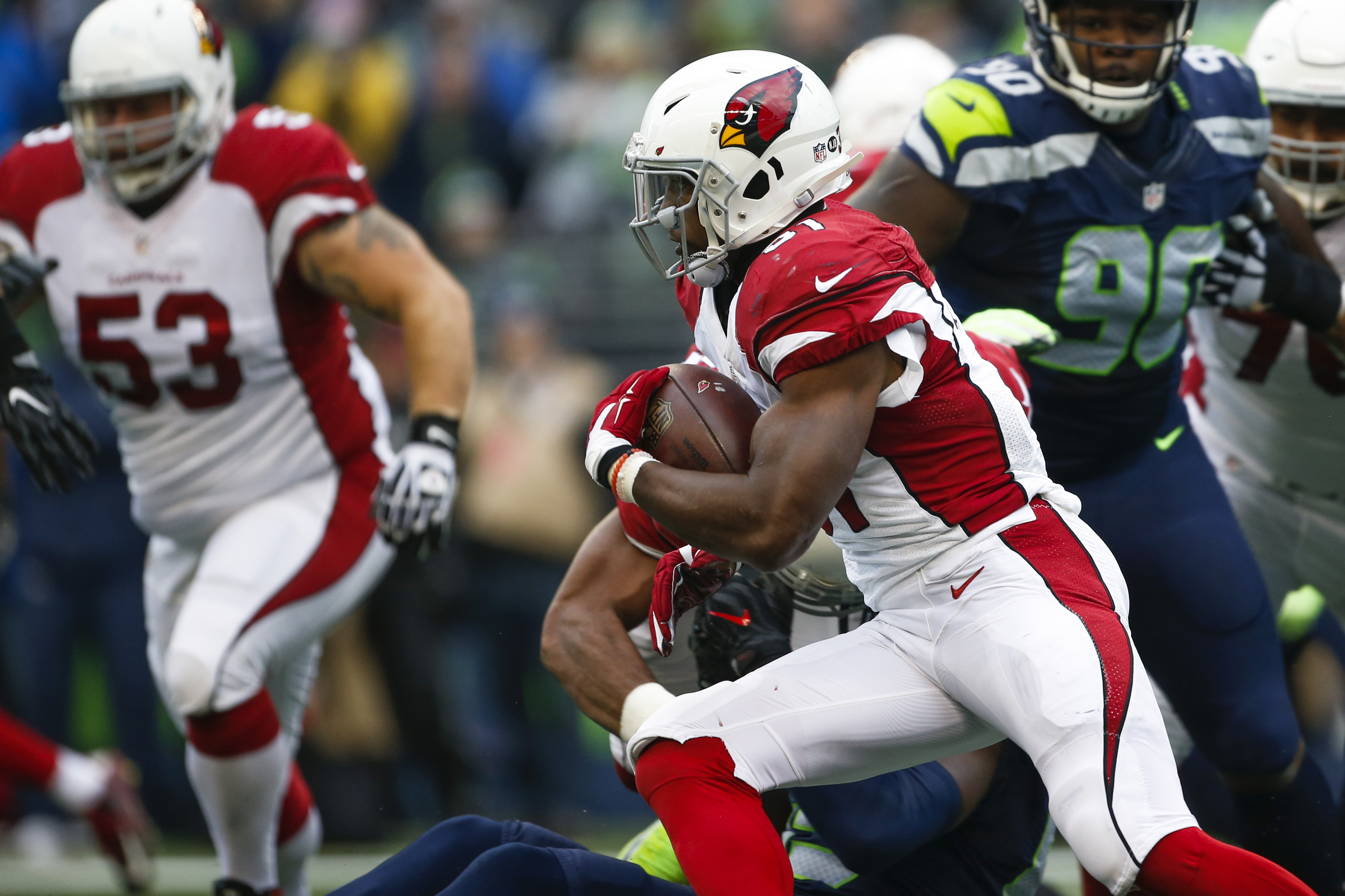 Dec 24, 2016; Seattle, WA, USA; Arizona Cardinals running back David Johnson (31) rushes against the Seattle Seahawks during the second quarter at CenturyLink Field. Mandatory Credit: Joe Nicholson-USA TODAY Sports