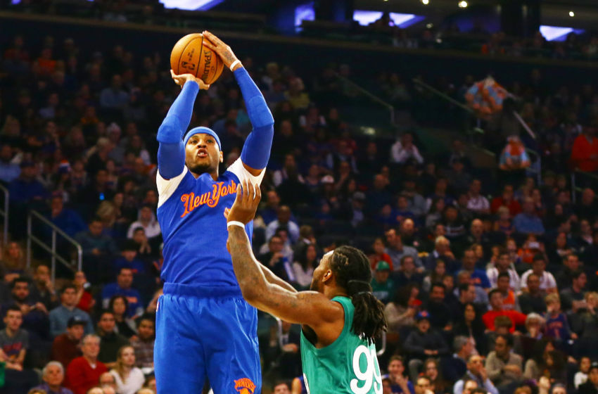 Dec 25, 2016; New York, NY, USA; New York Knicks forward Carmelo Anthony (7) takes a shot while being defended by Boston Celtics forward Jae Crowder (99) during the first half at Madison Square Garden. Mandatory Credit: Andy Marlin-USA TODAY Sports