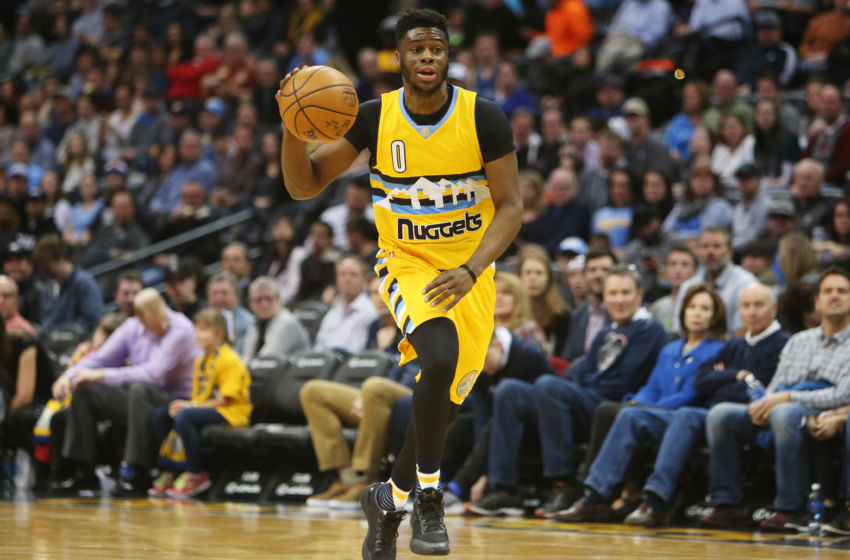 Dec 28, 2016; Denver, CO, USA; Denver Nuggets guard Emmanuel Mudiay (0) brings the ball up the court during the first half against the Minnesota Timberwolves at Pepsi Center. Mandatory Credit: Chris Humphreys-USA TODAY Sports
