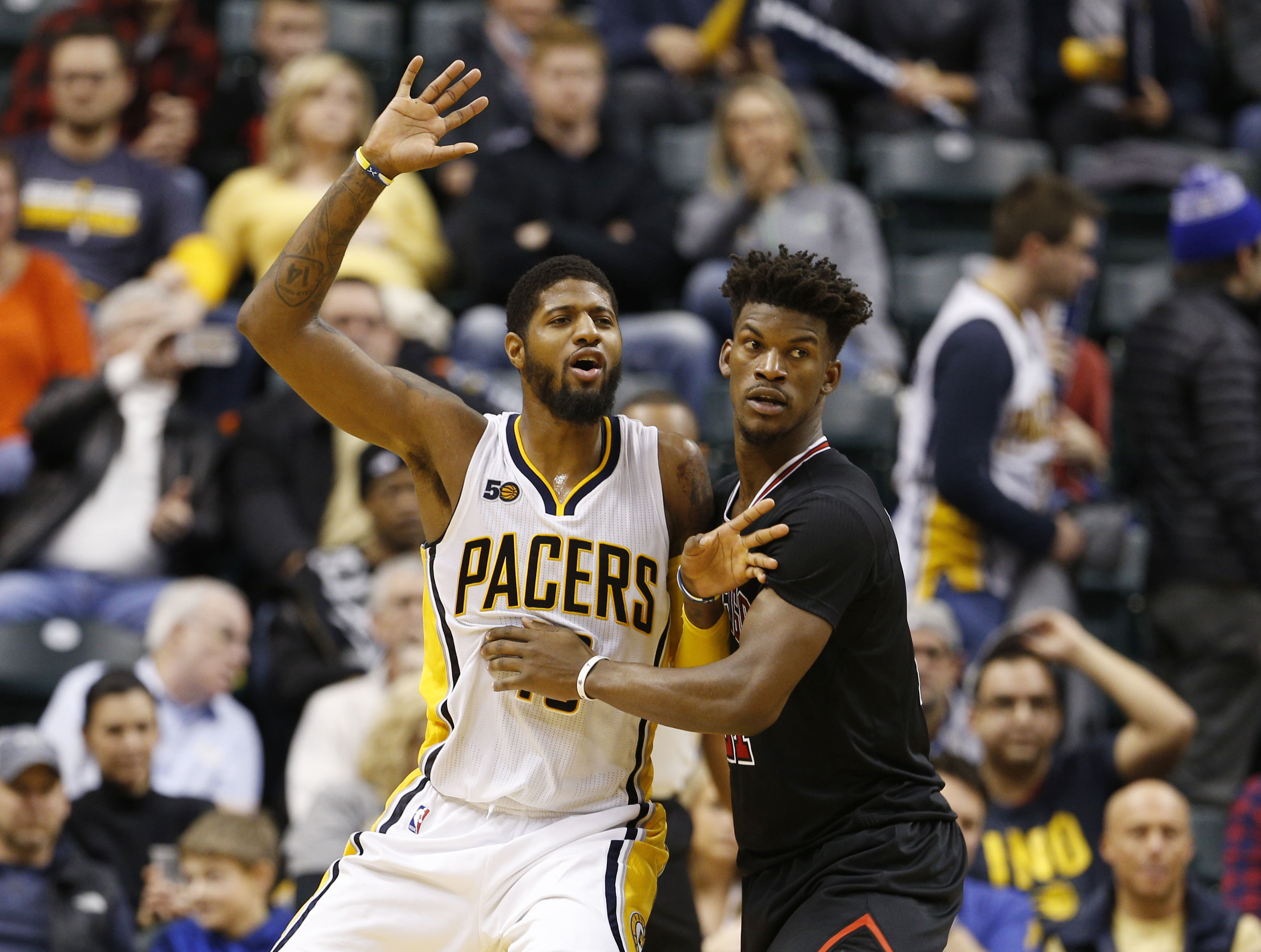 Dec 30, 2016; Indianapolis, IN, USA; Indiana Pacers forward Paul George (13) is guarded by Chicago Bulls guard Jimmy Butler (21) at Bankers Life Fieldhouse. Indiana defeated Chicago 111-101. Mandatory Credit: Brian Spurlock-USA TODAY Sports