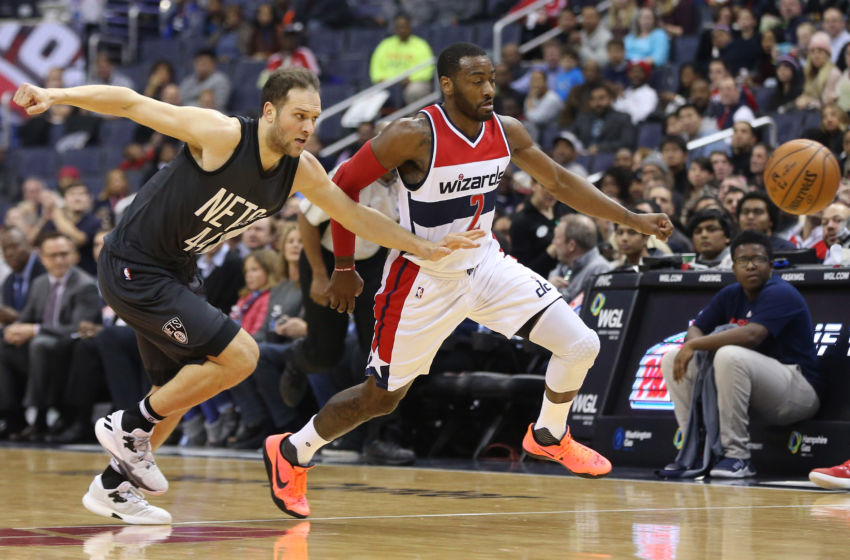 Dec 30, 2016; Washington, DC, USA; Washington Wizards guard John Wall (2) and Brooklyn Nets guard Bojan Bogdanovic (44) chase a loose ball in the first quarter at Verizon Center. Mandatory Credit: Geoff Burke-USA TODAY Sports