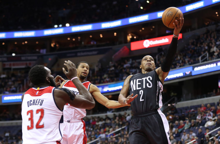 Dec 30, 2016; Washington, DC, USA; Brooklyn Nets guard Randy Foye (2) shoots the ball as Washington Wizards guard Trey Burke (33) and Wizards forward Daniel Ochefu (32) defend in the fourth quarter at Verizon Center. The Wizards won 118-95. Mandatory Credit: Geoff Burke-USA TODAY Sports