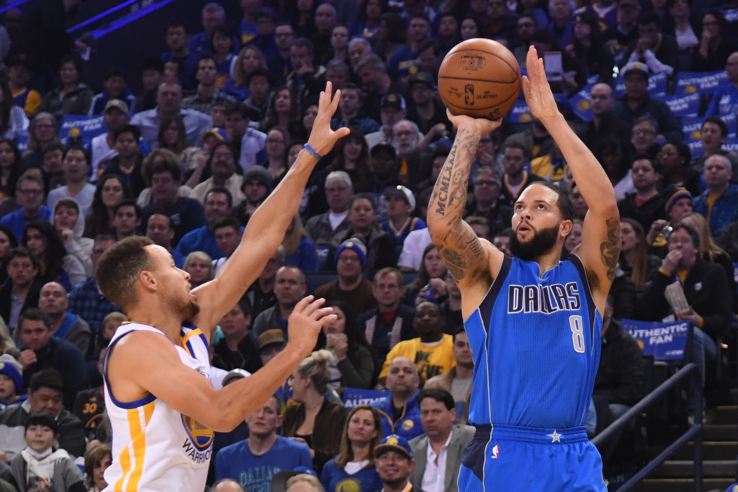 December 30, 2016; Oakland, CA, USA; Dallas Mavericks guard Deron Williams (8) shoots the basketball against Golden State Warriors guard Stephen Curry (30) during the first quarter at Oracle Arena. Mandatory Credit: Kyle Terada-USA TODAY Sports