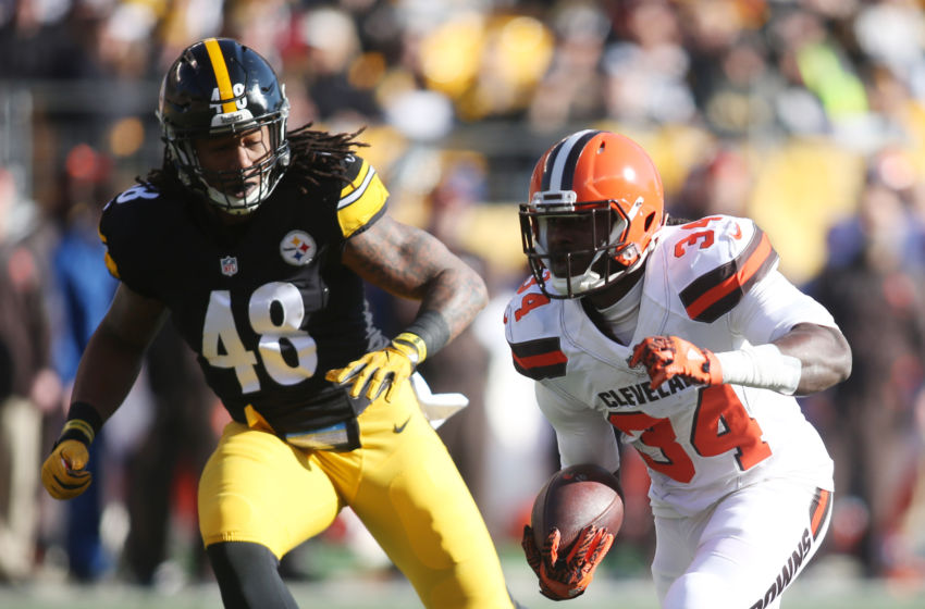 Jan 1, 2017; Pittsburgh, PA, USA; Cleveland Browns running back Isaiah Crowell (34) rushes the ball against Pittsburgh Steelers outside linebacker Bud Dupree (48) during the first quarter at Heinz Field. Mandatory Credit: Charles LeClaire-USA TODAY Sports