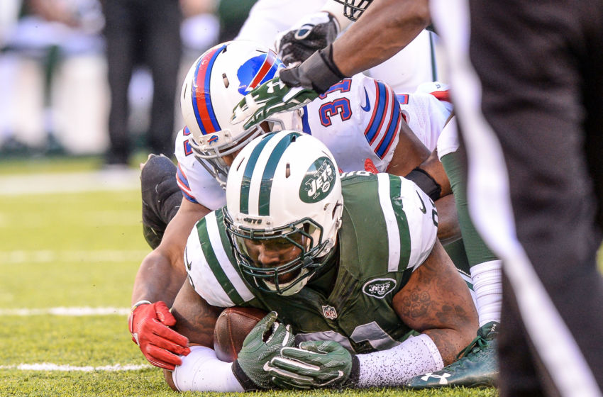Jan 1, 2017; East Rutherford, NJ, USA; New York Jets defensive end Sheldon Richardson (91) recovers the fumble after he hit Buffalo Bills defensive back Jonathan Dowling (31) during the 3rd quarter at MetLife Stadium. Mandatory Credit: Dennis Schneidler-USA TODAY Sports