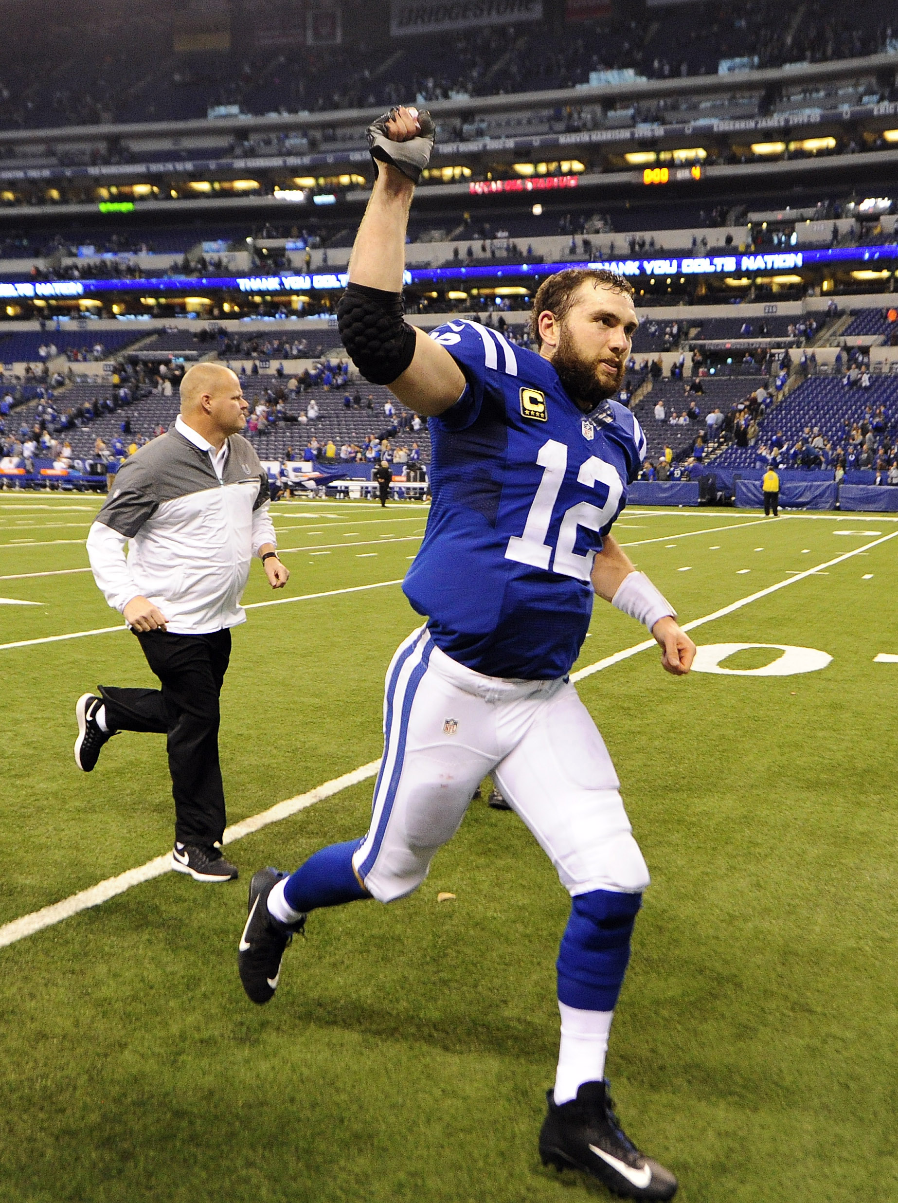 Jan 1, 2017; Indianapolis, IN, USA; Indianapolis Colts quarterback Andrew Luck(12) runs off the field after their victory against the Jacksonville Jaguars at Lucas Oil Stadium. Mandatory Credit: Thomas J. Russo-USA TODAY Sports