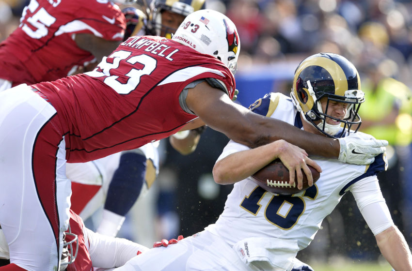 January 1, 2017; Los Angeles, CA, USA; Los Angeles Rams quarterback Jared Goff (16) is brought down by Arizona Cardinals defensive end Calais Campbell (93) during the first half at Los Angeles Memorial Coliseum. Mandatory Credit: Gary A. Vasquez-USA TODAY Sports
