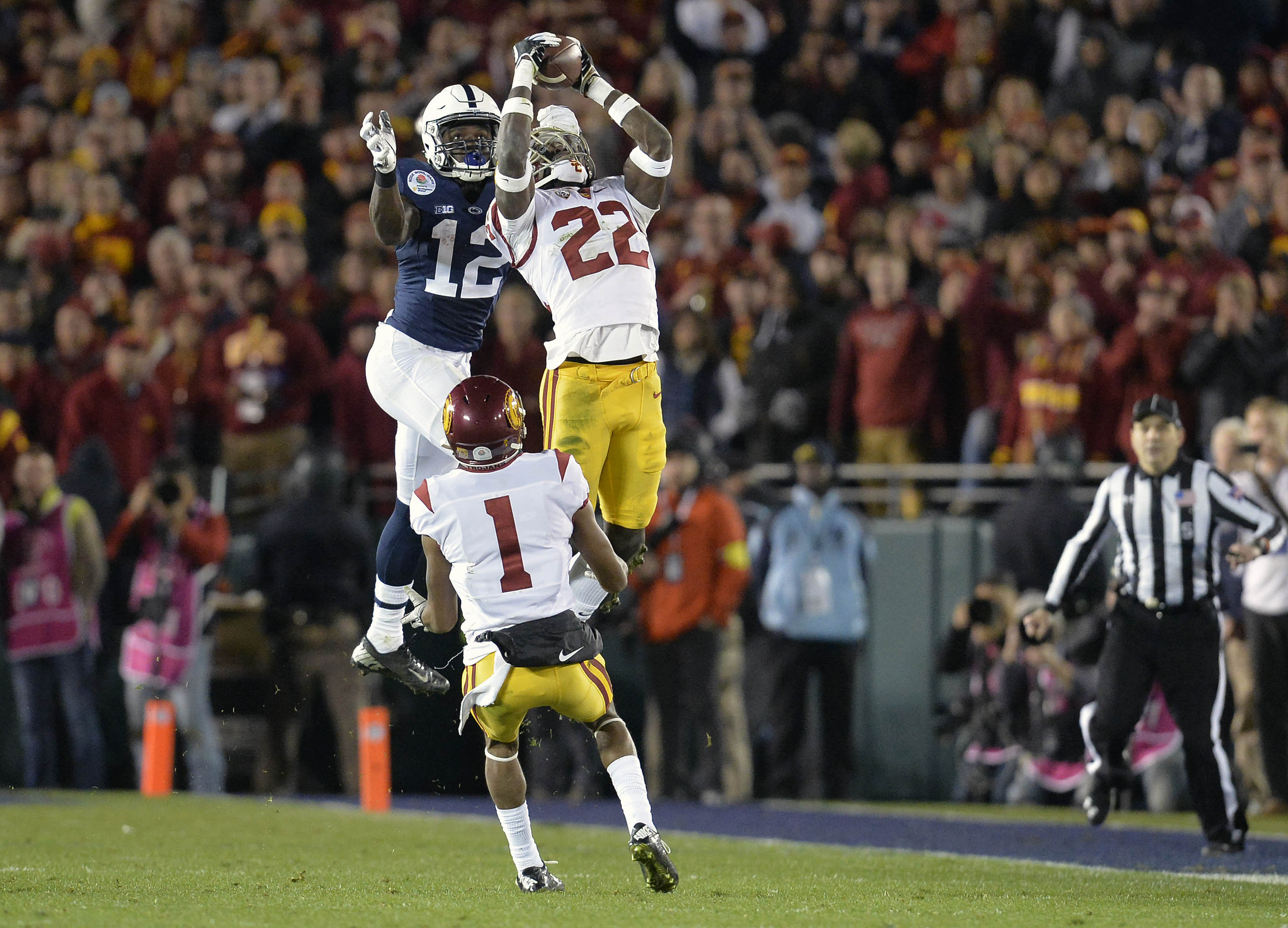 January 2, 2017; Pasadena, CA, USA; Southern California Trojans defensive back Leon McQuay III (22) intercepts a pass intended for Penn State Nittany Lions wide receiver Chris Godwin (12) during the second half of the 2017 Rose Bowl game at the Rose Bowl. Mandatory Credit: Gary A. Vasquez-USA TODAY Sports