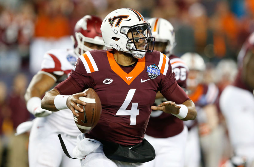 Dec 29, 2016; Charlotte, NC, USA; Virginia Tech Hokies quarterback Jerod Evans (4) looks to pass the ball during the first quarter against the Arkansas Razorbacks during the Belk Bowl at Bank of America Stadium. Mandatory Credit: Jeremy Brevard-USA TODAY Sports