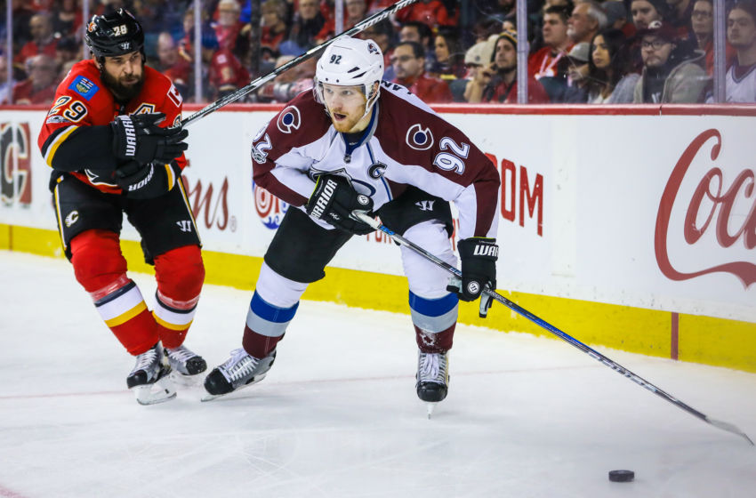 Jan 4, 2017; Calgary, Alberta, CAN; Colorado Avalanche left wing Gabriel Landeskog (92) and Calgary Flames defenseman Deryk Engelland (29) battle for the puck during the second period at Scotiabank Saddledome. Mandatory Credit: Sergei Belski-USA TODAY Sports
