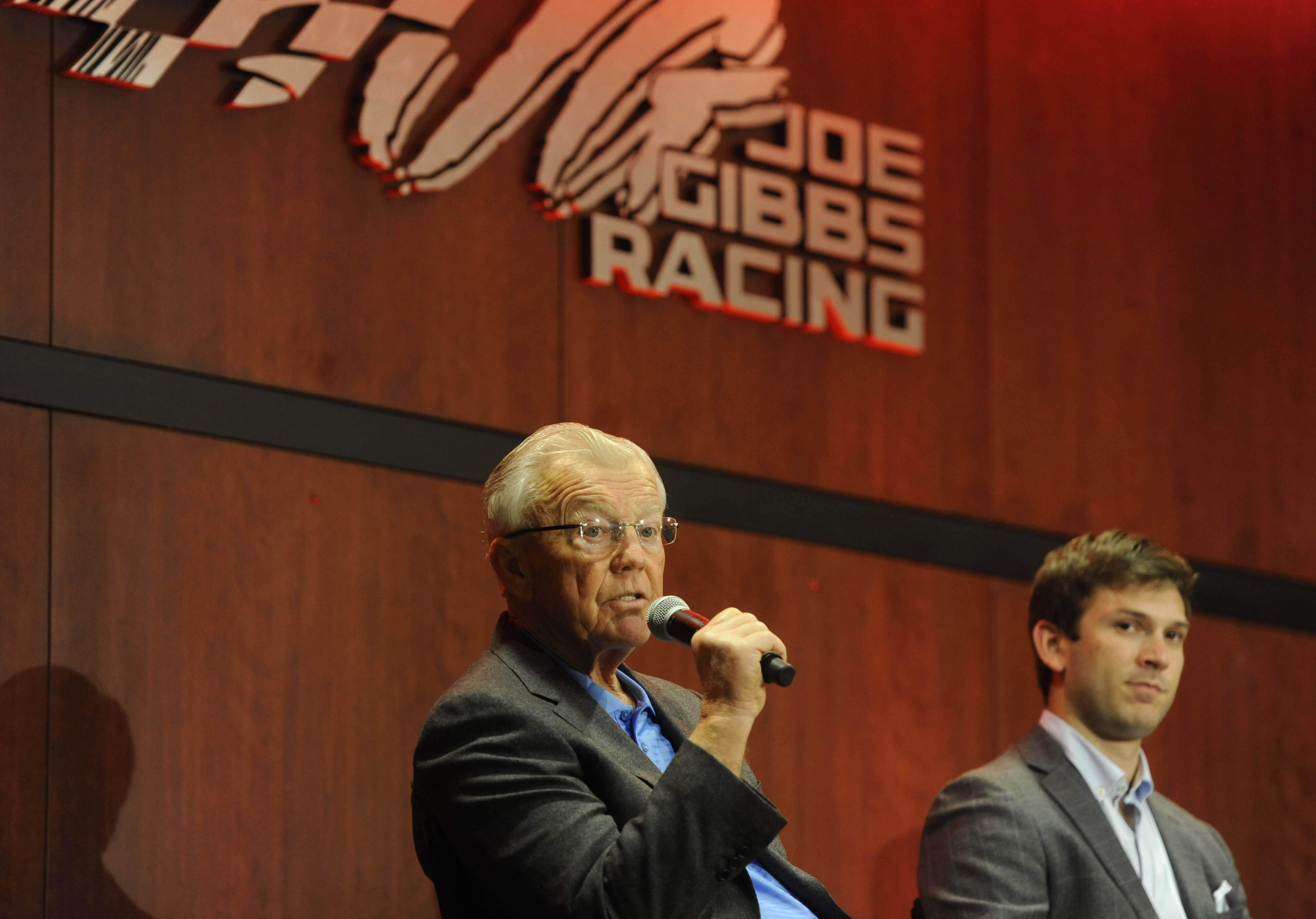 Jan 11, 2017; Huntersville, NC, USA; Team owner Joe Gibbs (left) and Daniel Suarez (right), driver of the #19 Arris Toyota driven on the Monster Energy NASCAR Cup Series, address the media after the announcement of the retirement of driver Carl Edwards during a press conference at Joe Gibbs Racing headquarters. Mandatory Credit: Sam Sharpe-USA TODAY Sports