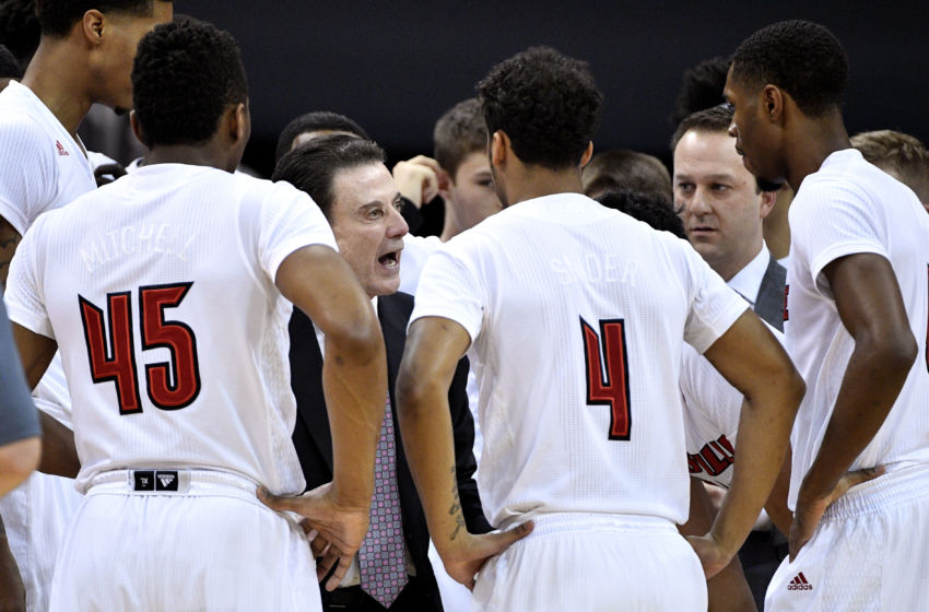 Jan 11, 2017; Louisville, KY, USA; Louisville Cardinals head coach Rick Pitino talks with his players in a time out during the first half against the Pittsburgh Panthers at KFC Yum! Center. Mandatory Credit: Jamie Rhodes-USA TODAY Sports
