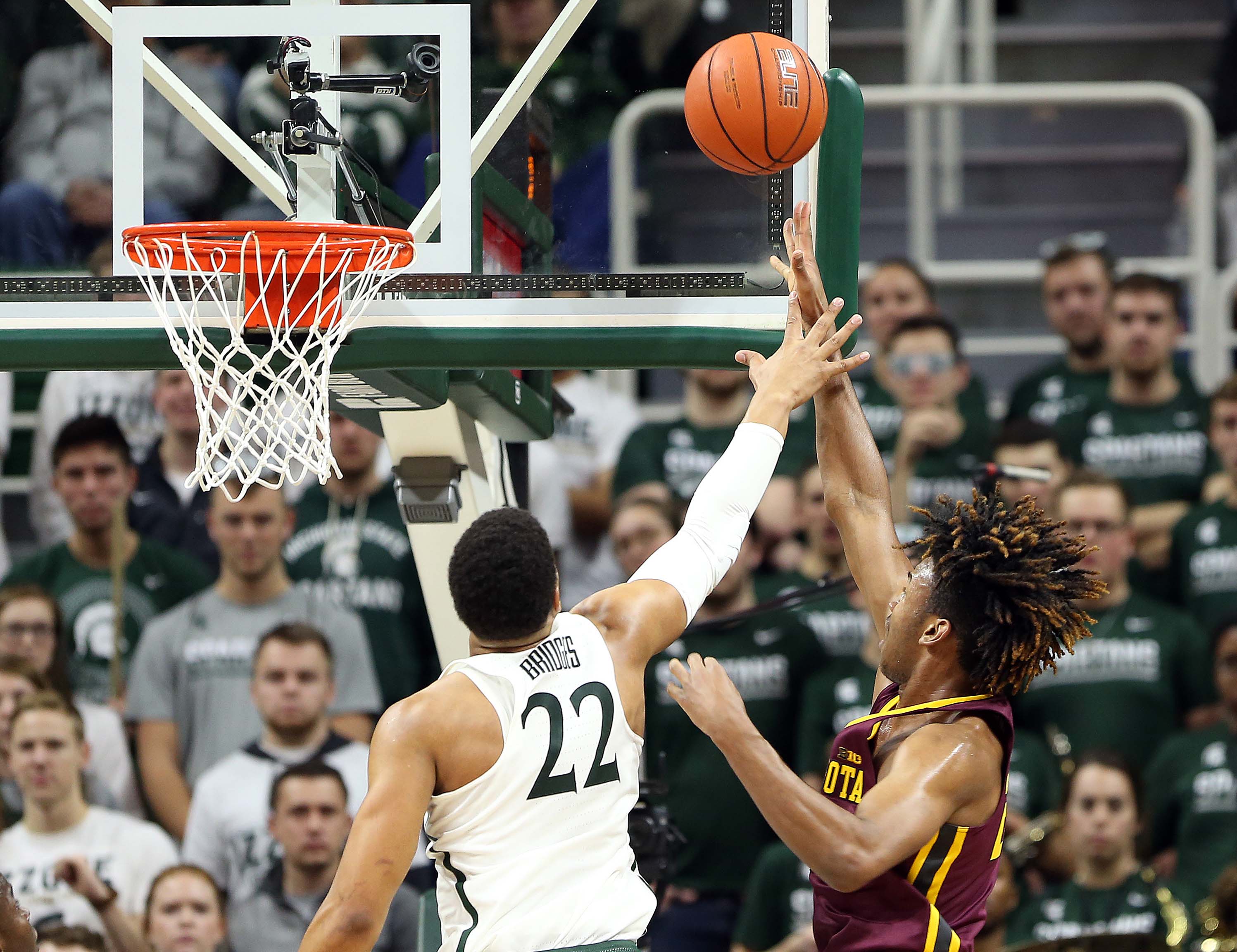 Jan 11, 2017; East Lansing, MI, USA; Michigan State Spartans guard Miles Bridges (22) defends Minnesota Golden Gophers forward Eric Curry (24) during the second half of a game at Jack Breslin Student Events Center. Mandatory Credit: Mike Carter-USA TODAY Sports