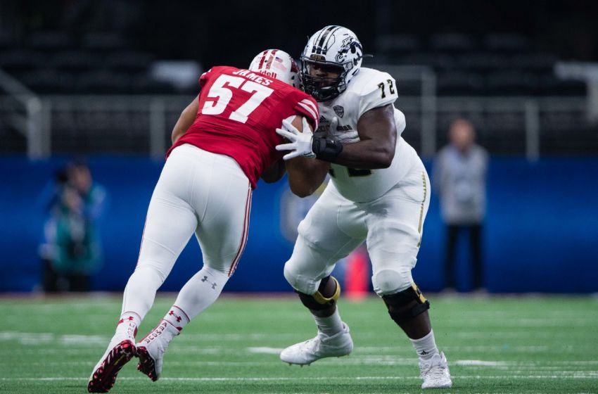 Jan 2, 2017; Arlington, TX, USA; Wisconsin Badgers defensive end Alec James (57) and Western Michigan Broncos offensive lineman Taylor Moton (72) in action in the 2017 Cotton Bowl game at AT&T Stadium. The Badgers defeat the Broncos 24-16. Mandatory Credit: Jerome Miron-USA TODAY Sports