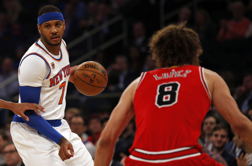 Jan 12, 2017; New York, NY, USA; New York Knicks forward Carmelo Anthony (7) dribbles the ball being defended by Chicago Bulls center Robin Lopez (8) during the first quarter at Madison Square Garden. Mandatory Credit: Adam Hunger-USA TODAY Sports