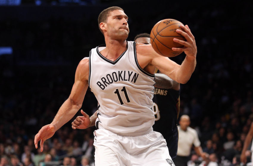 Jan 12, 2017; Brooklyn, NY, USA; Brooklyn Nets center Brook Lopez (11) is fouled as he moves by New Orleans Pelicans power forward Terrence Jones (9) during the fourth quarter at Barclays Center. Mandatory Credit: Brad Penner-USA TODAY Sports