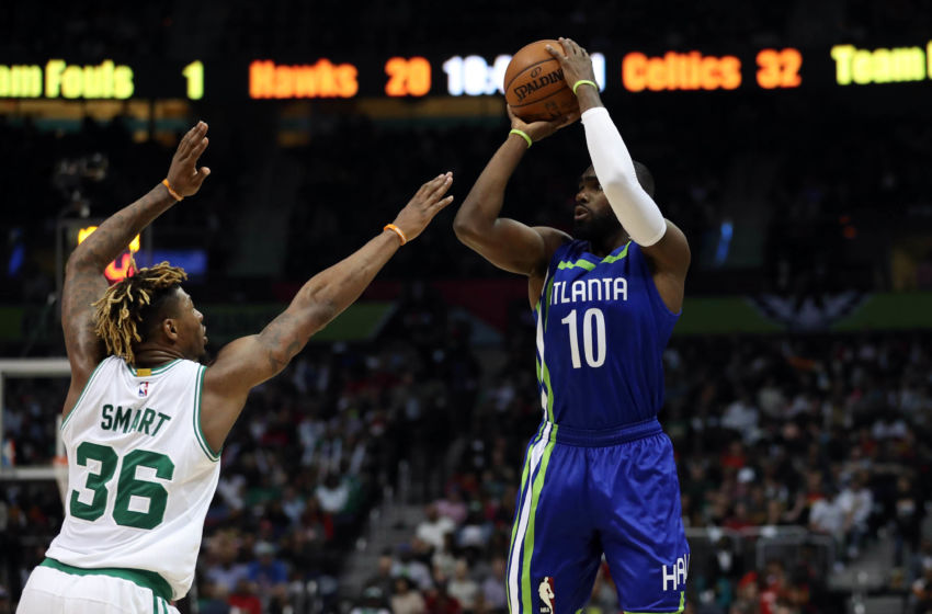 Jan 13, 2017; Atlanta, GA, USA; Atlanta Hawks guard Tim Hardaway Jr. (10) attempts a shot against Boston Celtics guard Marcus Smart (36) in the second quarter of their game at Philips Arena. Mandatory Credit: Jason Getz-USA TODAY Sports