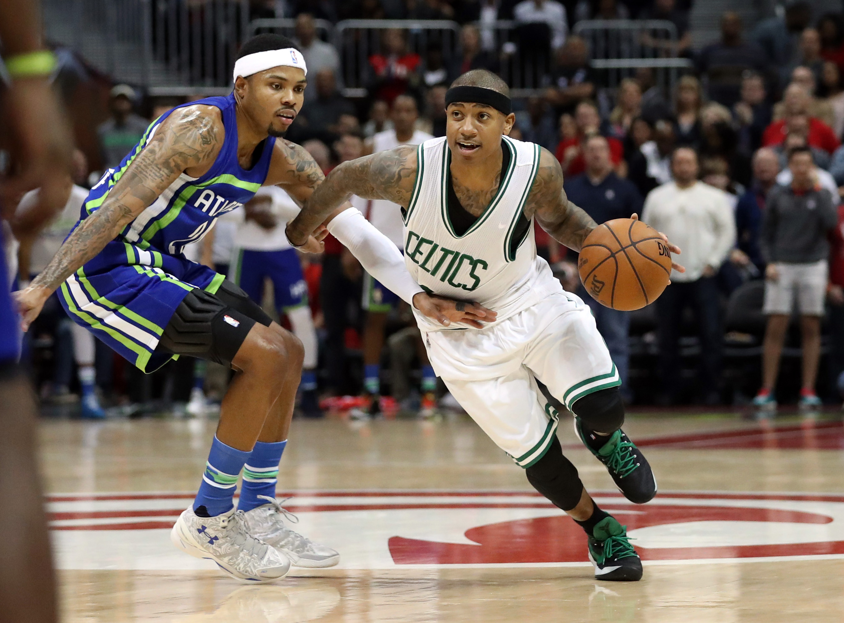 Jan 13, 2017; Atlanta, GA, USA; Boston Celtics guard Isaiah Thomas (4) drives against Atlanta Hawks forward Kent Bazemore (24) in the fourth quarter of their game at Philips Arena. The Celtics won 103-101. Mandatory Credit: Jason Getz-USA TODAY Sports
