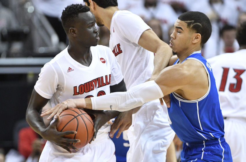 Jan 14, 2017; Louisville, KY, USA; Duke Blue Devils forward Jayson Tatum (0) pressures the dribble of Louisville Cardinals forward Deng Adel (22) during the first half at KFC Yum! Center. Mandatory Credit: Jamie Rhodes-USA TODAY Sports
