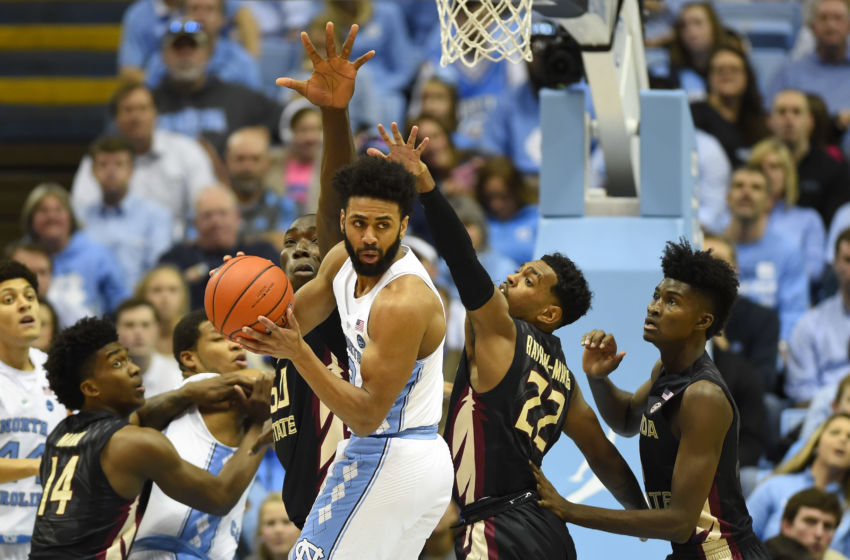 Jan 14, 2017; Chapel Hill, NC, USA; North Carolina Tar Heels guard Joel Berry II (2) passes the ball as Florida State Seminoles guard Terance Mann (14) and Florida State Seminoles center Michael Ojo (50) and guard Xavier Rathan-Mayes (22) and forward Jonathan Isaac (1) defend in the first half at Dean E. Smith Center. Mandatory Credit: Bob Donnan-USA TODAY Sports