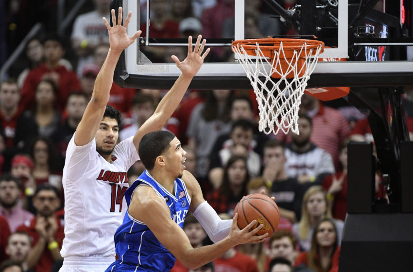 Jan 14, 2017; Louisville, KY, USA; Duke Blue Devils forward Jayson Tatum (0) shoots against Louisville Cardinals forward Anas Mahmoud (14) during the second half at KFC Yum! Center. Louisville defeated Duke 78-69. Mandatory Credit: Jamie Rhodes-USA TODAY Sports