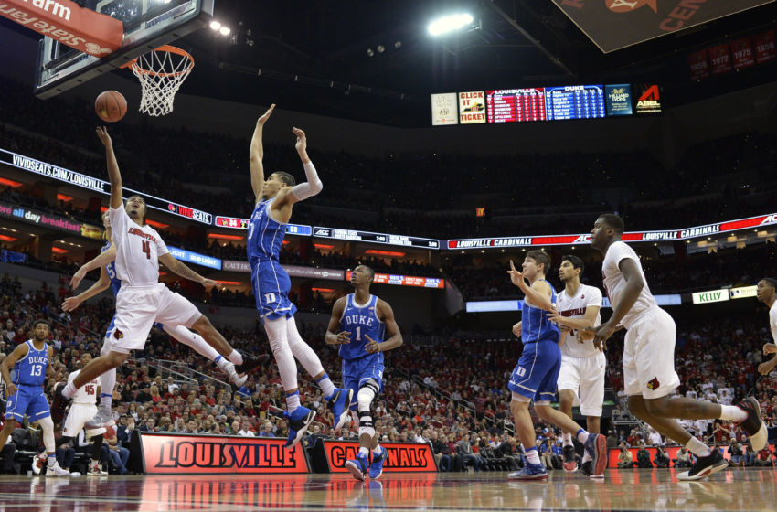 Jan 14, 2017; Louisville, KY, USA; Louisville Cardinals guard Quentin Snider (4) shoots against Duke Blue Devils forward Jayson Tatum (0) during the second half at KFC Yum! Center. Louisville defeated Duke 78-69. Mandatory Credit: Jamie Rhodes-USA TODAY Sports