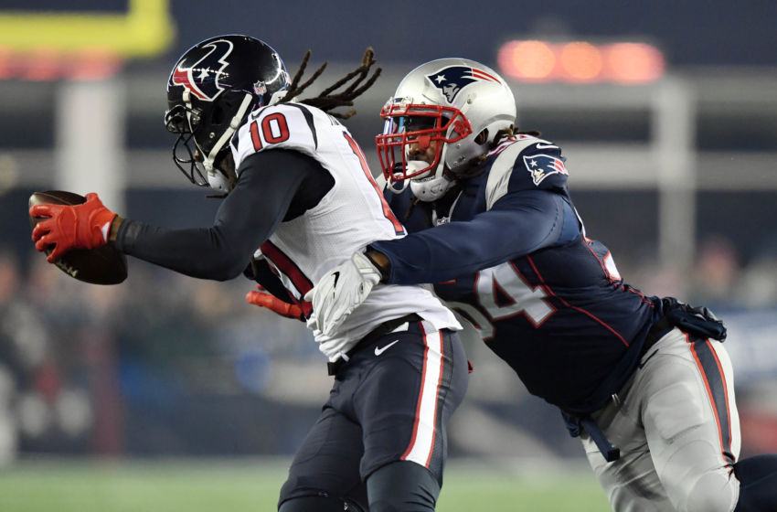 Jan 14, 2017; Foxborough, MA, USA; Houston Texans wide receiver DeAndre Hopkins (10) is tackled by New England Patriots middle linebacker Dont'a Hightower (54) during the first quarter in the AFC Divisional playoff game at Gillette Stadium. Mandatory Credit: James Lang-USA TODAY Sports