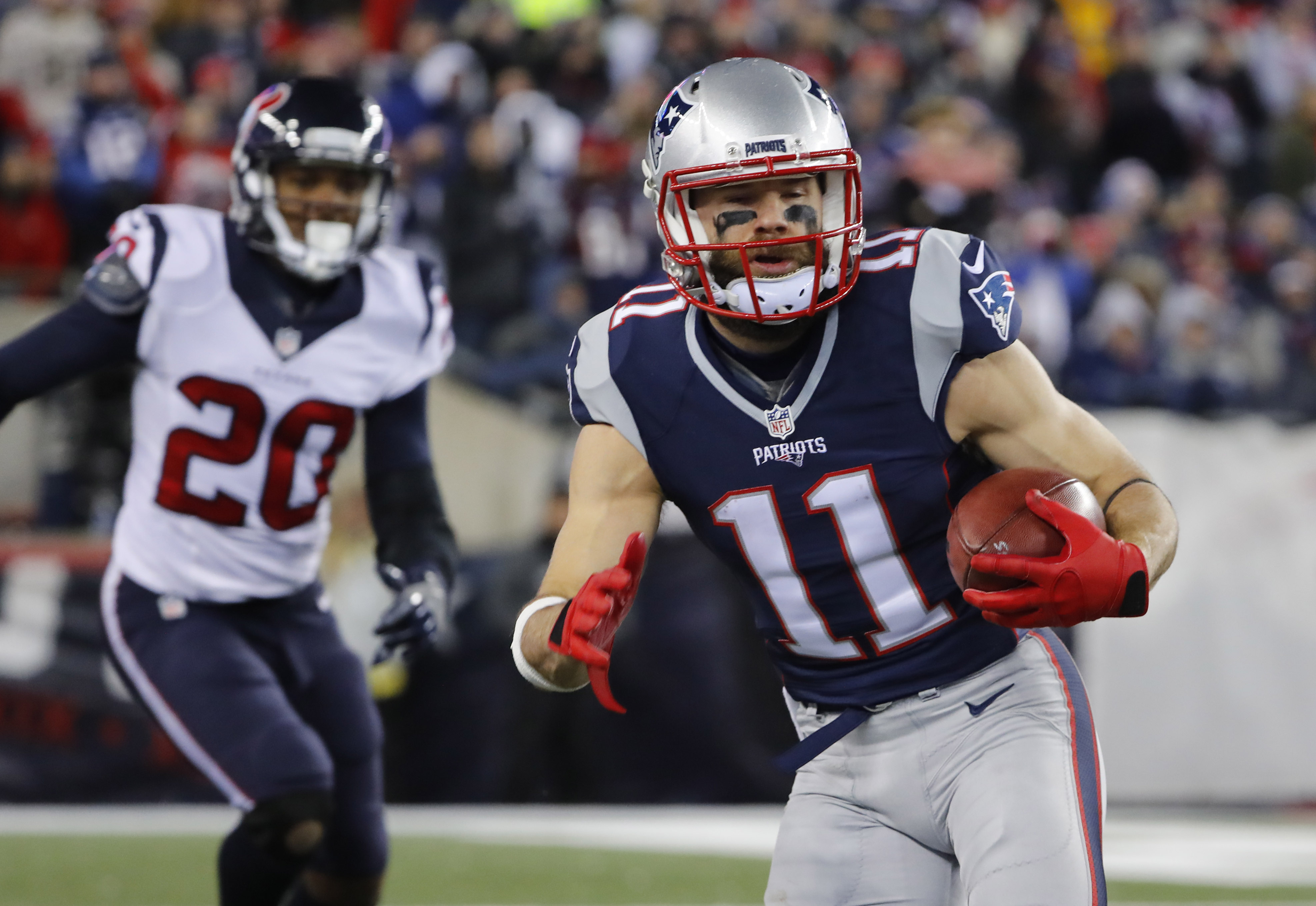 Jan 14, 2017; Foxborough, MA, USA; New England Patriots wide receiver Julian Edelman (11) runs with the ball against the Houston Texans during the first half in the AFC Divisional playoff game at Gillette Stadium. Mandatory Credit: Winslow Townson-USA TODAY Sports