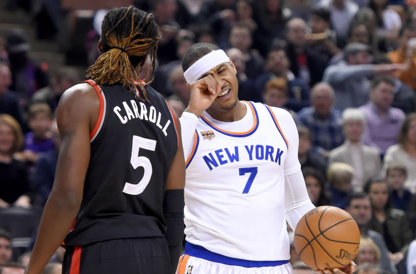 Jan 15, 2017; Toronto, Ontario, CAN; New York Knicks forward Carmelo Anthony (7) reacts after being poked in the eye by Toronto Raptors forward DeMarre Carroll (5) in the first quarter at Air Canada Centre. Mandatory Credit: Dan Hamilton-USA TODAY Sports