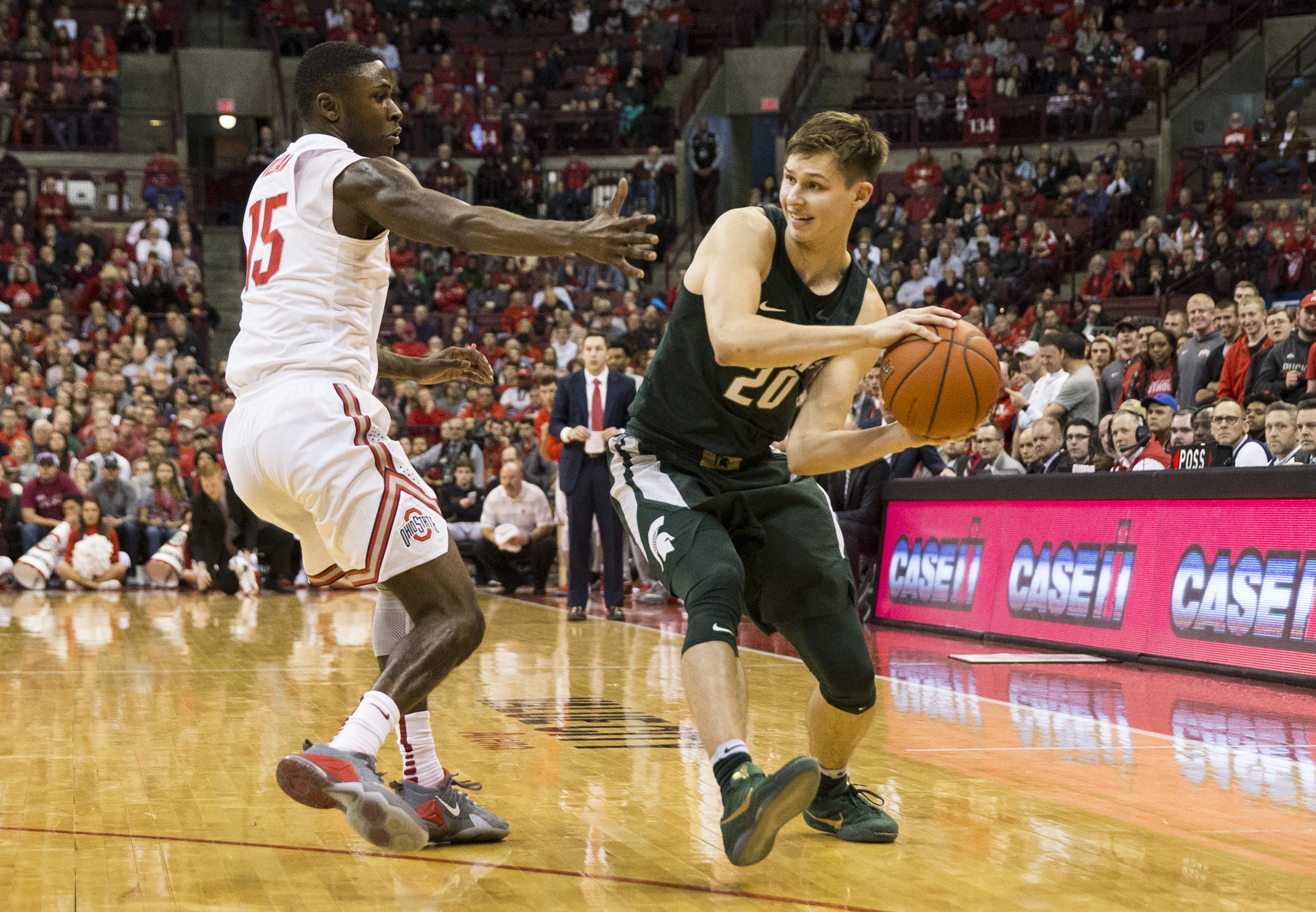 Jan 15, 2017; Columbus, OH, USA; Michigan State Spartans guard Matt McQuaid (20) looks to pass around Ohio State Buckeyes guard Kam Williams (15) at Value City Arena. Ohio State won the game 72-67. Mandatory Credit: Greg Bartram-USA TODAY Sports
