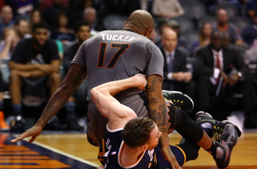 Jan 16, 2017; Phoenix, AZ, USA; Utah Jazz forward Gordon Hayward (bottom) reacts as Phoenix Suns forward P.J. Tucker (17) lands on top of him in the first quarter at Talking Stick Resort Arena. Mandatory Credit: Mark J. Rebilas-USA TODAY Sports